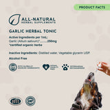 Garlic Herbal Tonic Product Facts panel listing active and inactive ingredients, beside a dog receiving a dropper.